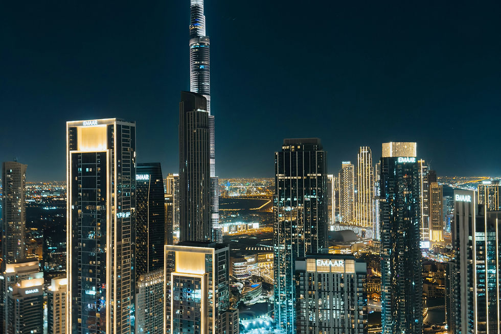 A view of a city at night from the top of a building