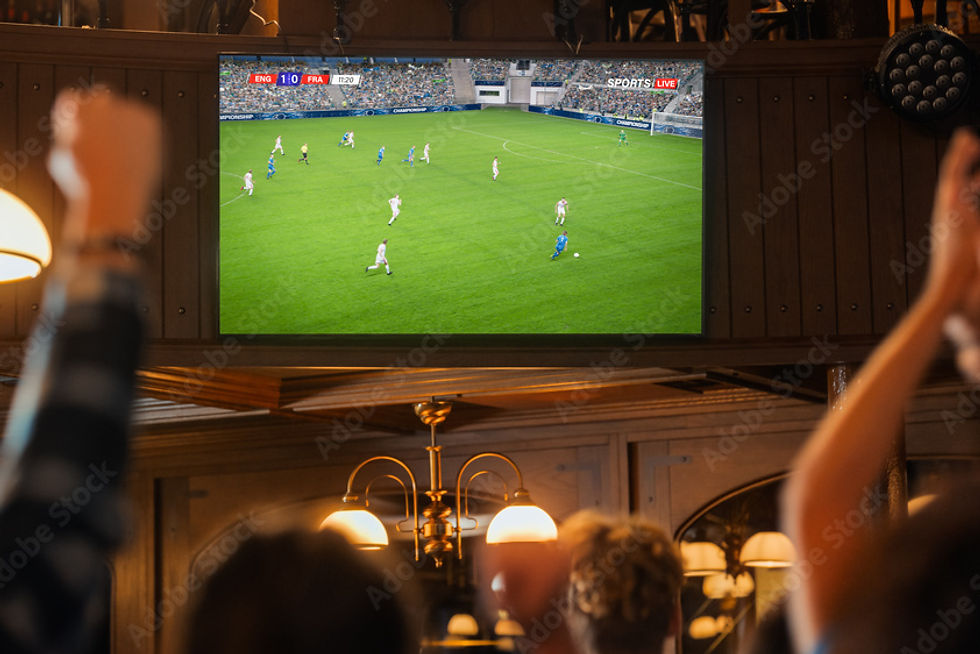 Group of Soccer Fans Watching a Live Football Match Broadcast in a ...