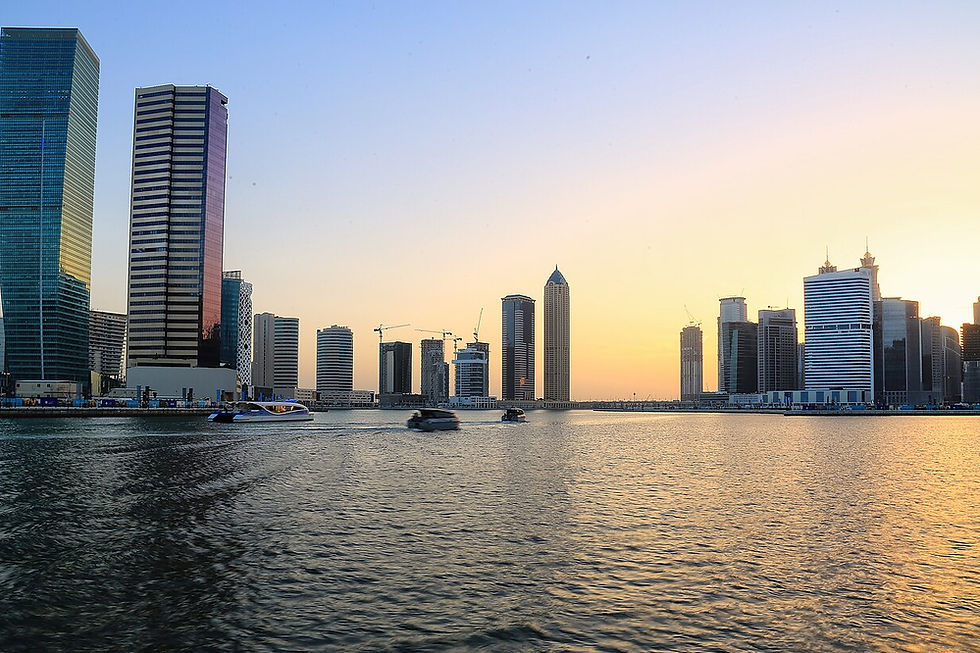 Dubai Water Canal at sunset with Business Bay towers