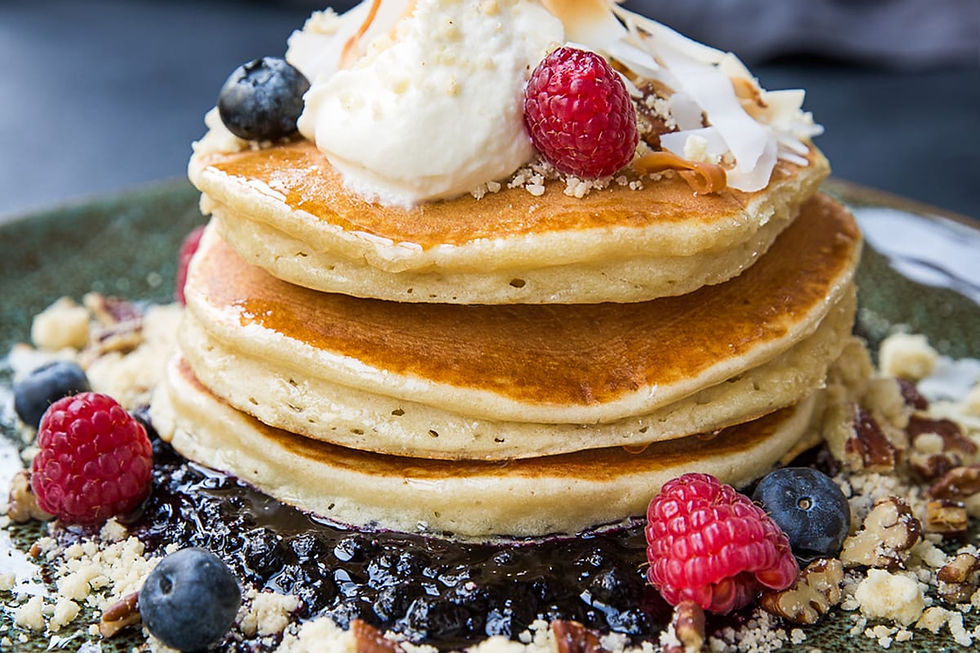 Jones the Grocer soufflé pancake dish with berry compote — signature breakfast food at Flag Island Sharjah; official ven
