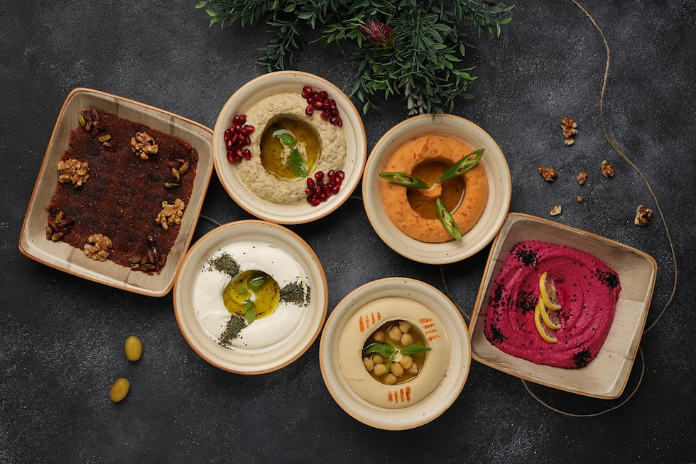 Middle eastern breakfast spread with warm bread and hummus