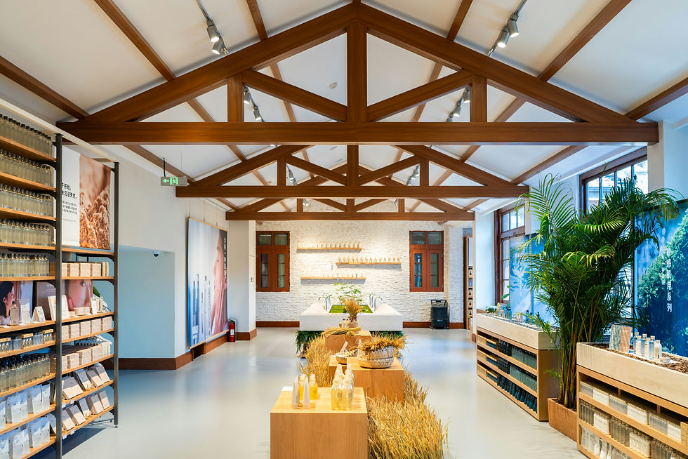 Interior of a well-lit retail store with wooden beams.