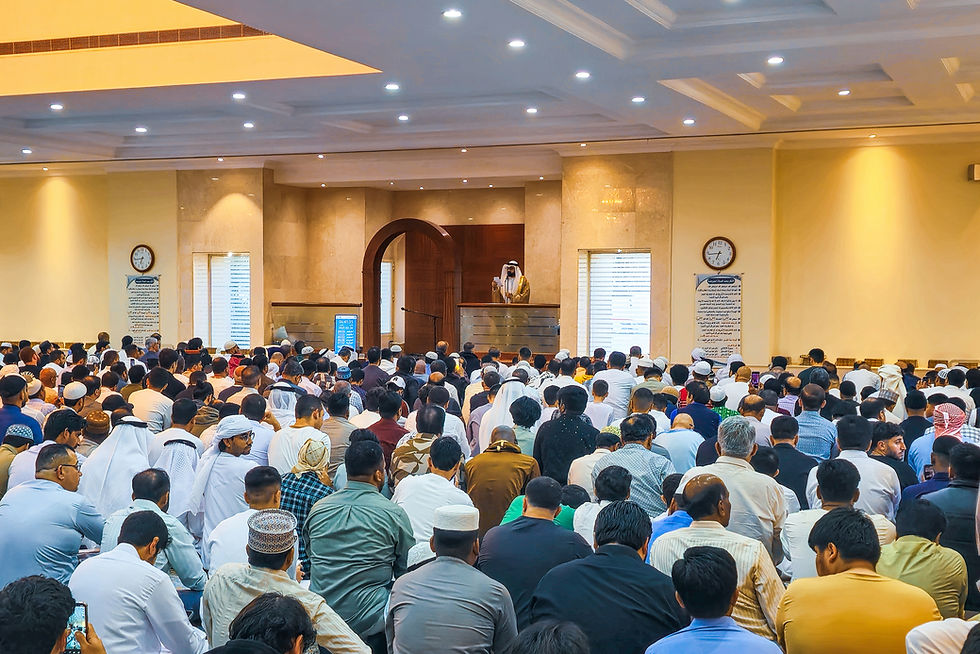 People praying together inside of a mosque