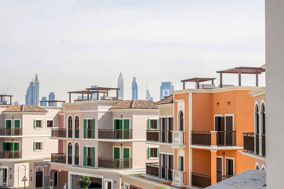 Colorful townhouses stand against a hazy skyline