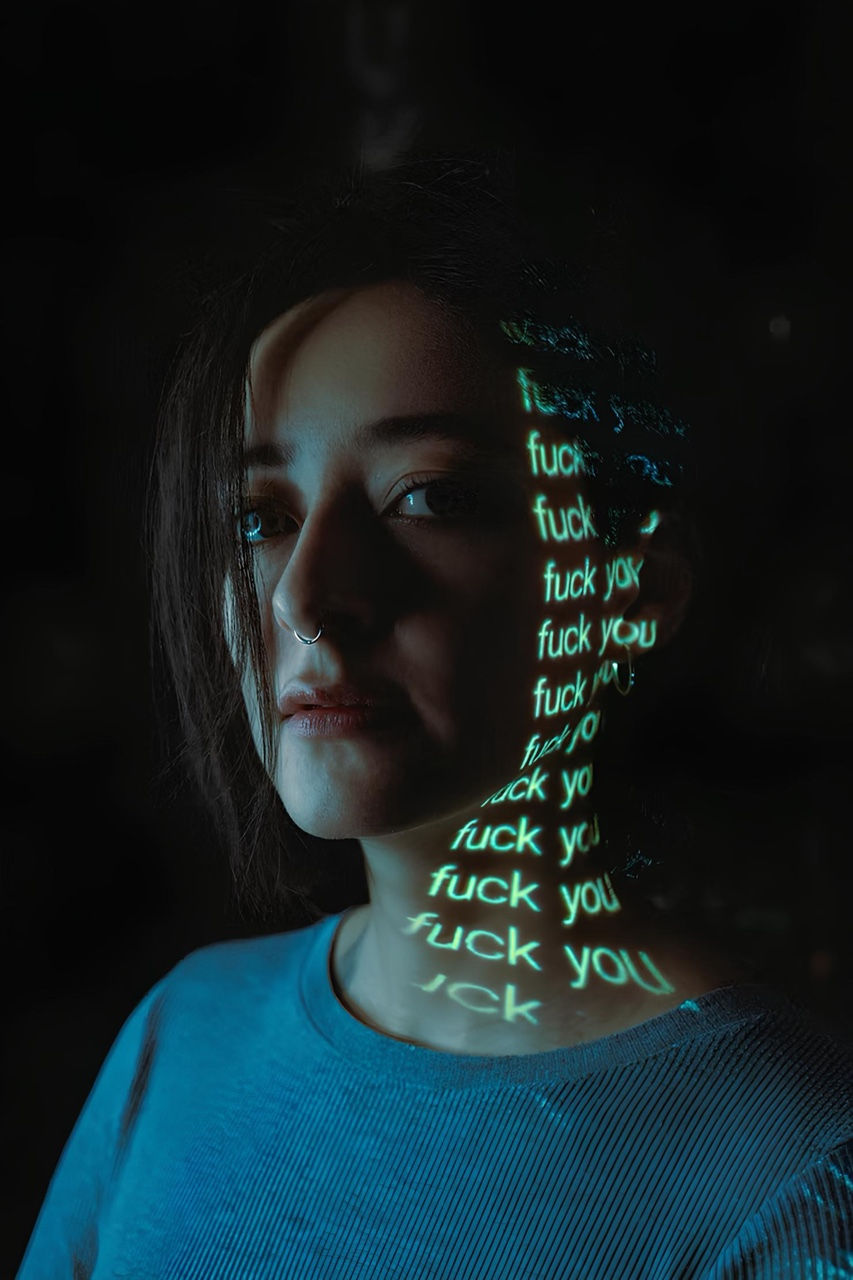 The picture shows a girl who is a victim of cyberbullying