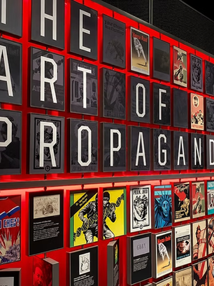 It is written "The art of propaganda" in this picture, and there are also some pages from the comic books in the picture