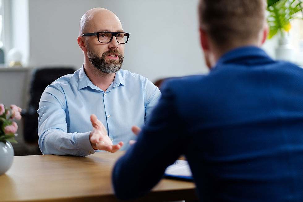 Middle-aged man attending job interview.