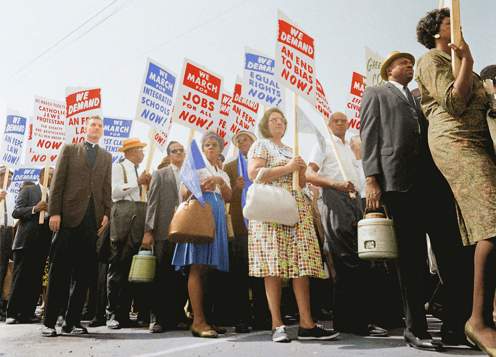 Marchers holding- signs demanding the right to vote at the march on Washington.