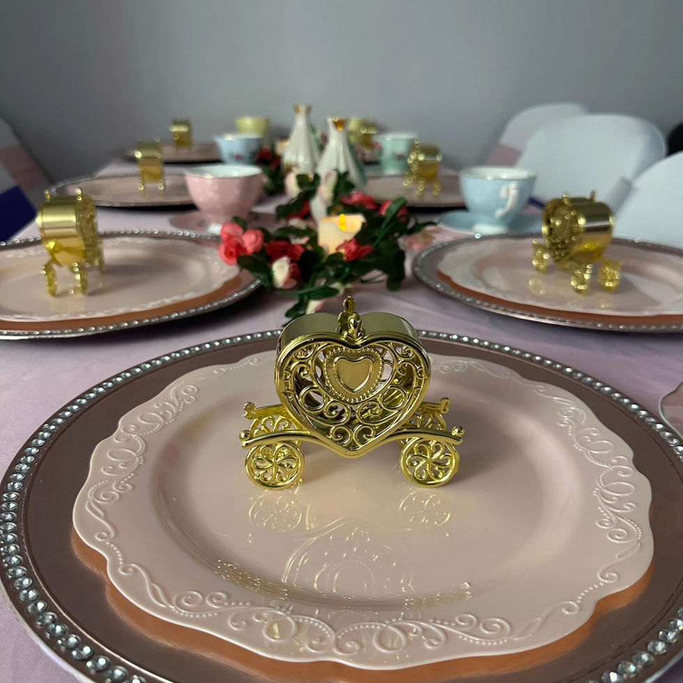 Elegant table setting with gold and pink accents.