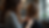 Eye-level view of a hairstylist cutting a client's layered hair
