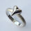 Thumbnail: Front and side view of silver heart ring from above showing shape, texture and finish.