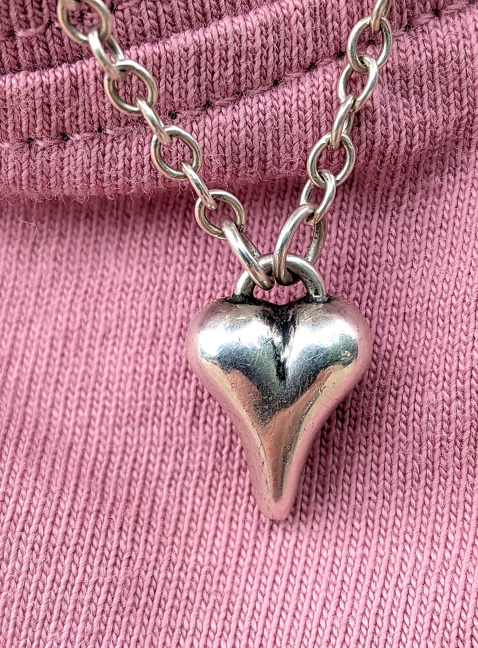Thumbnail: Sweet Hearts 3 pendant modelled against a pink top