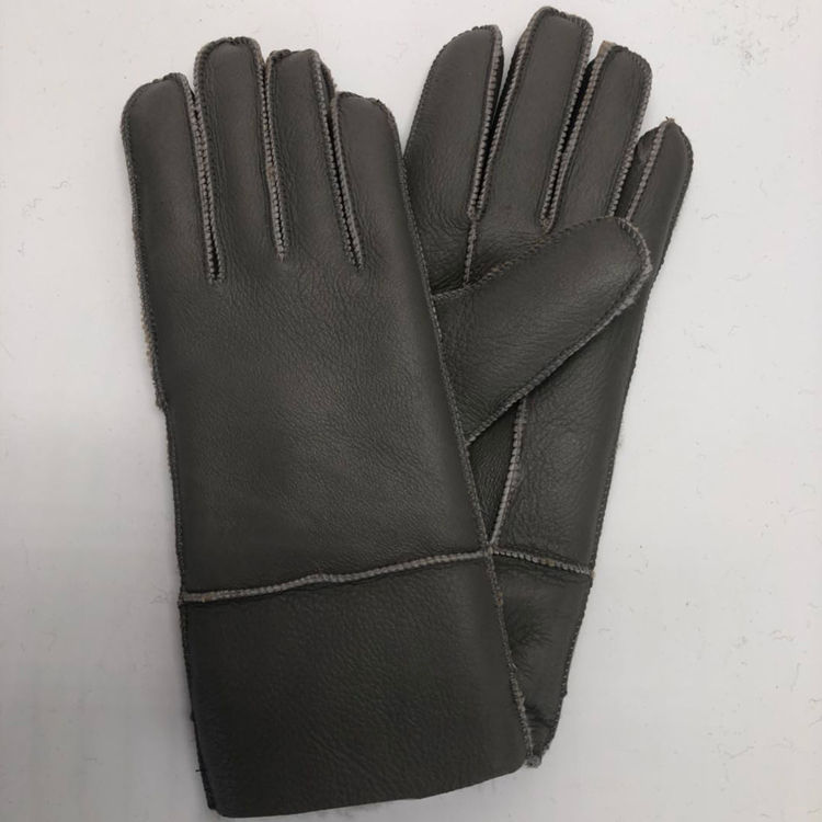 Fur-lined sheepskin gloves for women, designed for cold winter weather.