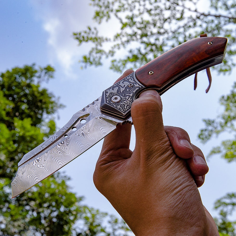 Leather sheath beside handmade Damascus steel pocket knife.