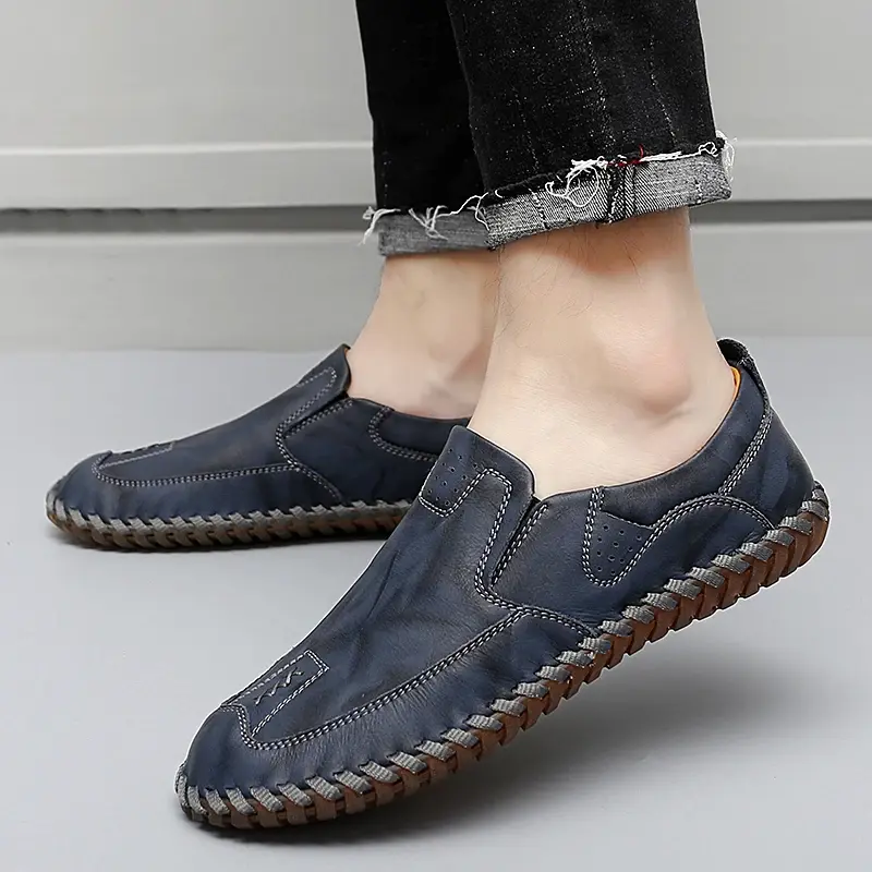 Thumbnail: Grey handmade men’s loafers styled with casual trousers