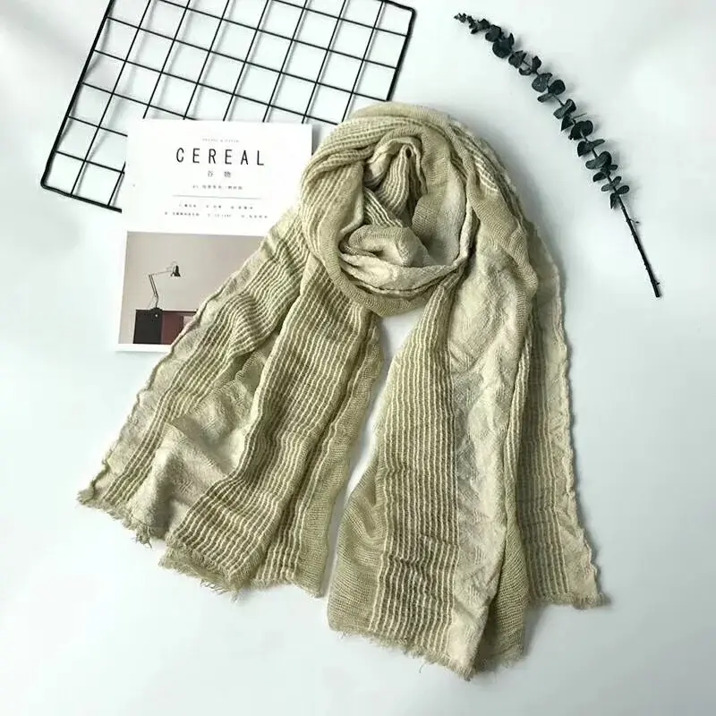 Thumbnail: Lightweight cotton linen scarf draped over shoulders for casual look