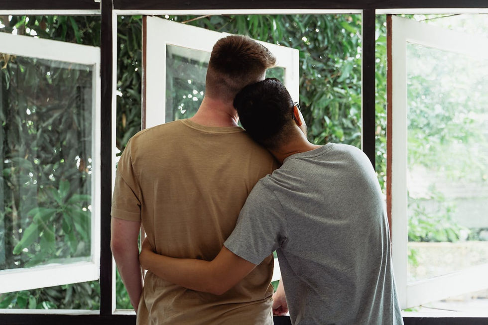 Two Men Looking Out a Window