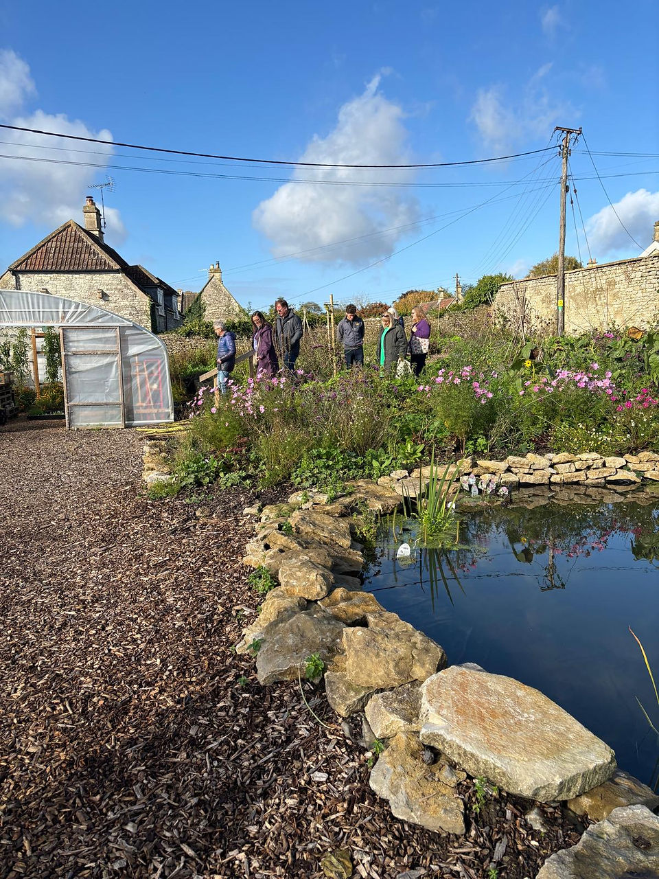 Toursof the Walled Garden during Apple Day showing the freshly finished pond