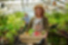 woman holding vegetables in tray | Grow for Life
