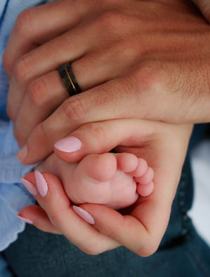 Closeup of hands and a foot