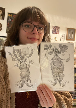 Dandelion and Strawberries being held.JPEG