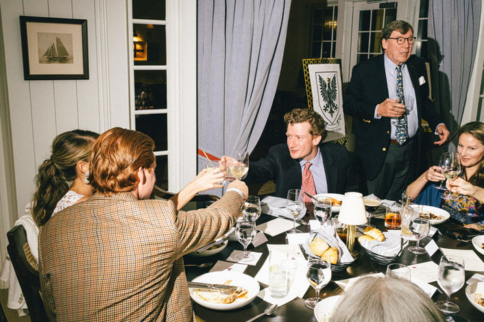 Documentary, 35mm film photography captures this wedding welcome dinner at the Daniel Island Yacht Club for this destination wedding couple from Boston, MA.