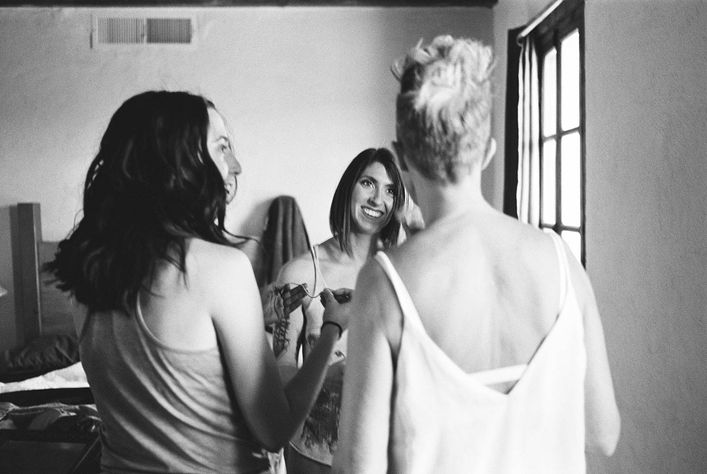 Documentary film wedding photographs from an intimate LGBTQ celebration at Hueco Tanks state park in the West Texas Desert.