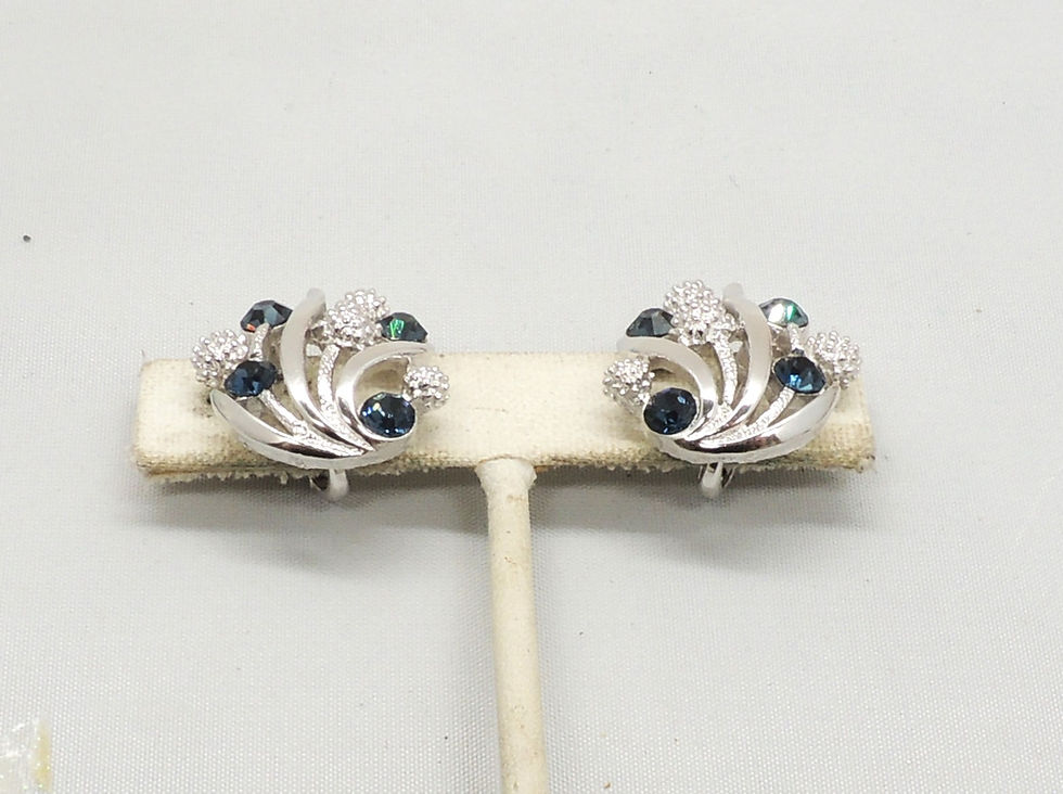Thumbnail: Vintage 1960s Signed Crown Trifari Rhodium Plated Faux-Sapphire Clip Earrings