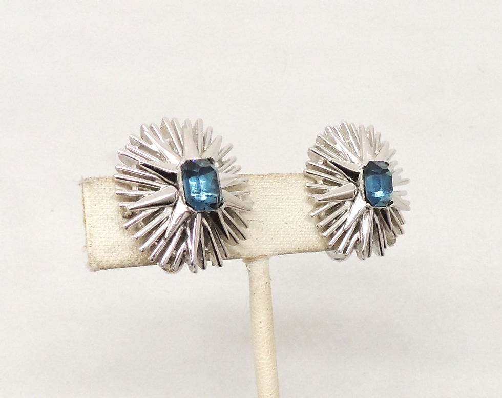 Thumbnail: Vintage 1965-6 Signed Trifari Rhodium Plated Faux-Sapphire "Burst" Clip Earrings