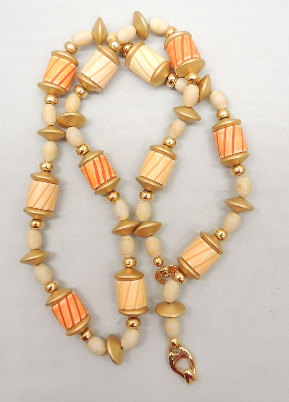 Thumbnail: Vintage Signed Napier Tan & Orange Hand Carved Beads Sautoir Necklace, 1985