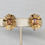 Thumbnail: Vintage Signed Crown Trifari Goldtone Faux-Topaz "Ribbon" Clip Earrings