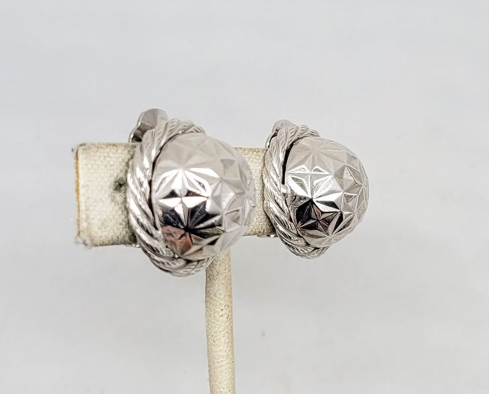 Thumbnail: Vintage 1970s Signed DeLillo Rhodium Plated Round Domed Faceted Clip Earrings