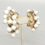 Thumbnail: Vintage Hattie Carnegie White Dangle Clip Earrings