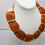 Thumbnail: Vintage 1970s Signed Valentino Garavani Goldtone Orange Resin Collar Necklace