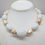 Thumbnail: Vintage 1980s Signed Givenchy Goldtone White Beaded Faux-Pearl Necklace
