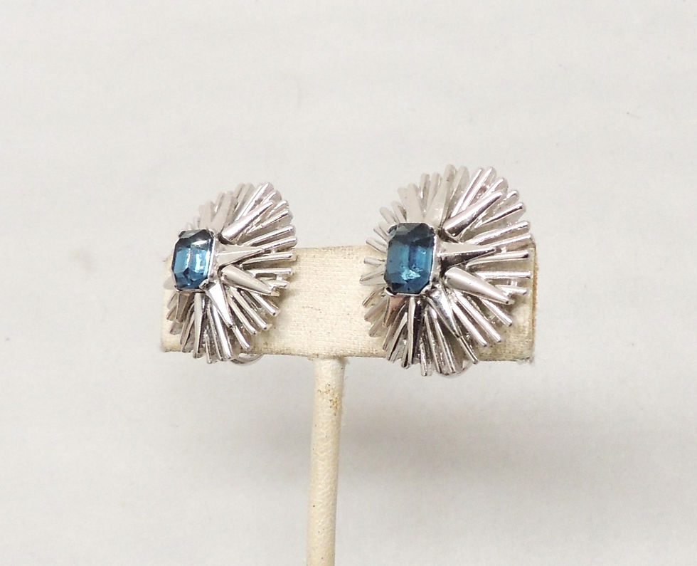 Thumbnail: Vintage 1965-6 Signed Trifari Rhodium Plated Faux-Sapphire "Burst" Clip Earrings