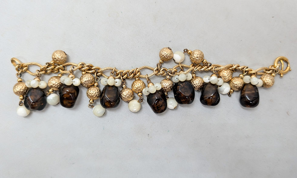 Thumbnail: Vintage 1960s Signed Napier Goldtone Faux-Topaz & Mother of Pearl Charm Bracelet