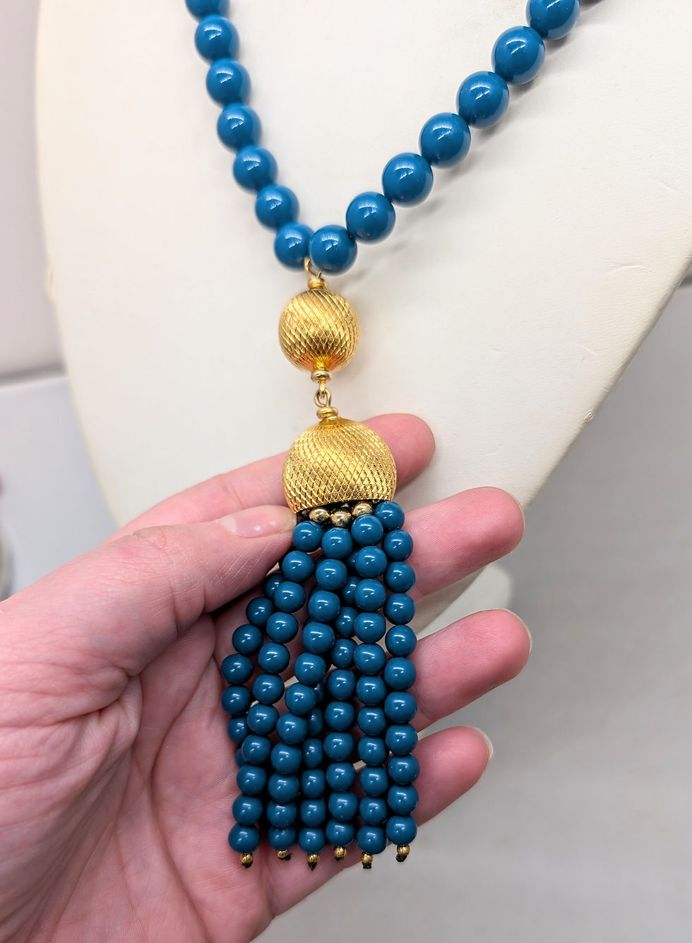 Thumbnail: Vintage 1980s Signed Napier Goldtone Beaded Faux-Lapis Tassel Pendant Necklace