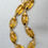 Thumbnail: Vintage 1980s Signed Givenchy Goldtone Amber Beaded Necklace