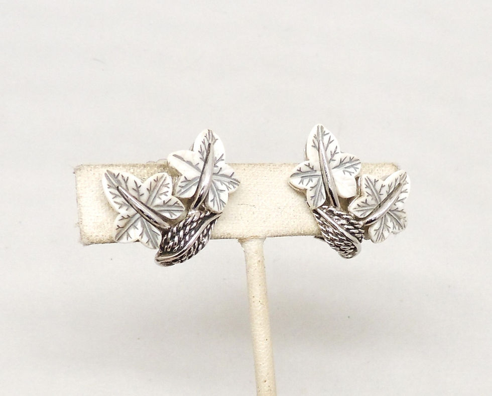 Thumbnail: Vintage 1950s Signed Boucher Rhodium Plated White Thermoset Leaves Clip Earrings