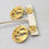 Thumbnail: Vintage 1970s Signed Trifari Modernist Goldtone Pendant Clip Earrings