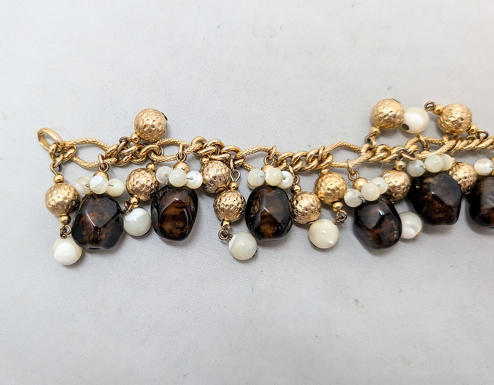 Thumbnail: Vintage 1960s Signed Napier Goldtone Faux-Topaz & Mother of Pearl Charm Bracelet