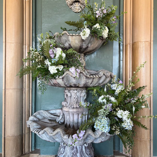 fort worth club fountain with lush flowers