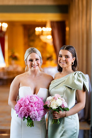 bride and bridesmaids with pink bouquets