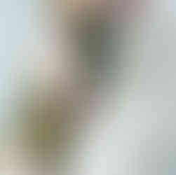 textured wedding cake with a cascade of fresh flowers