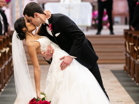 bride and groom first kiss