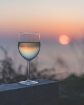 Kinsbrook Wines captured on a cliff with the sun setting in the backdrop in Cornwall