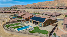 Mesquite home with solar panels, pool, and putting green.