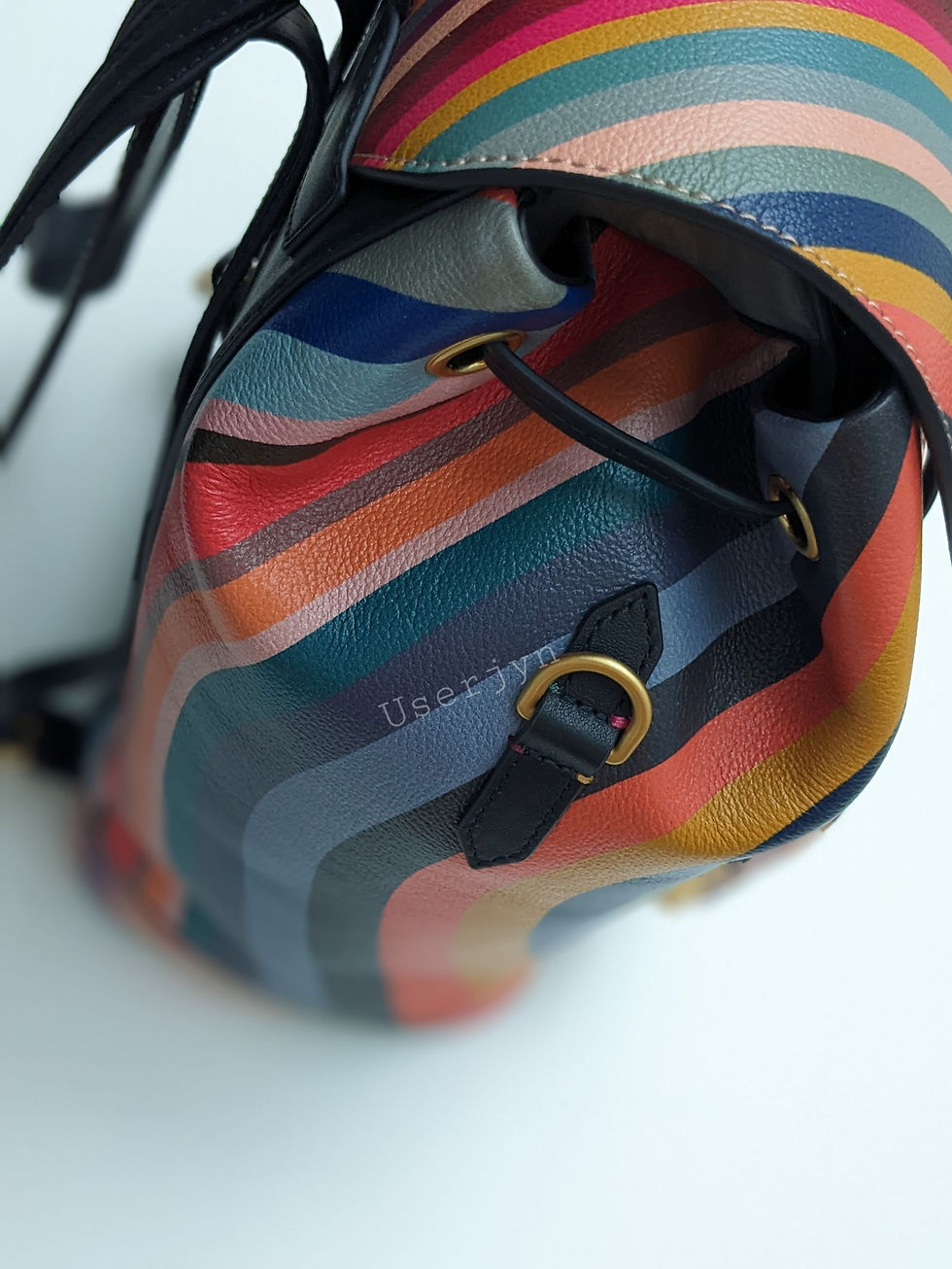 Thumbnail: Colorful striped backpack with visible text, perfect for daily use, stylish design.
