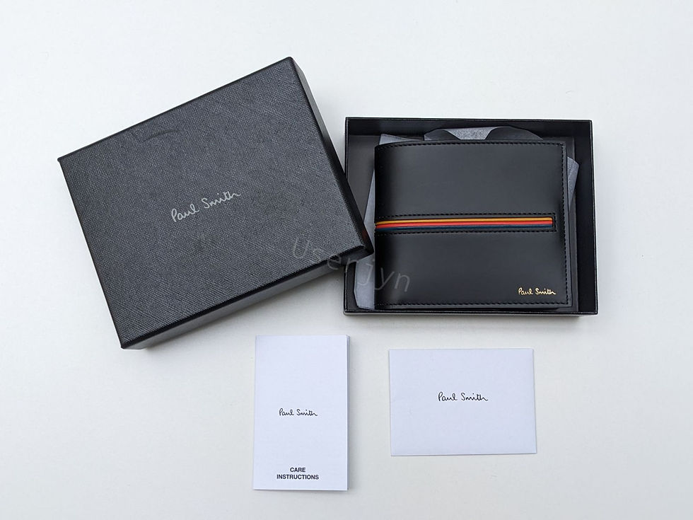 縮圖：Black Paul Smith wallet in an open box with white cards.
